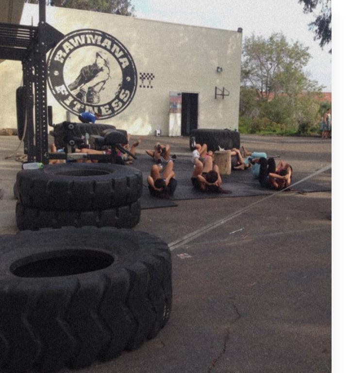 Members training together on the gym floor at Rawmana Fitness.